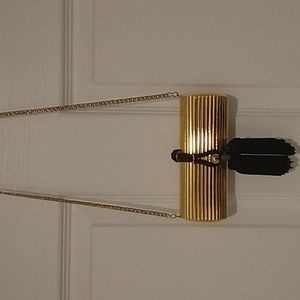 Elegant and Fun Vintage Gold Cylinder Clutch with Black Tassel Latch.